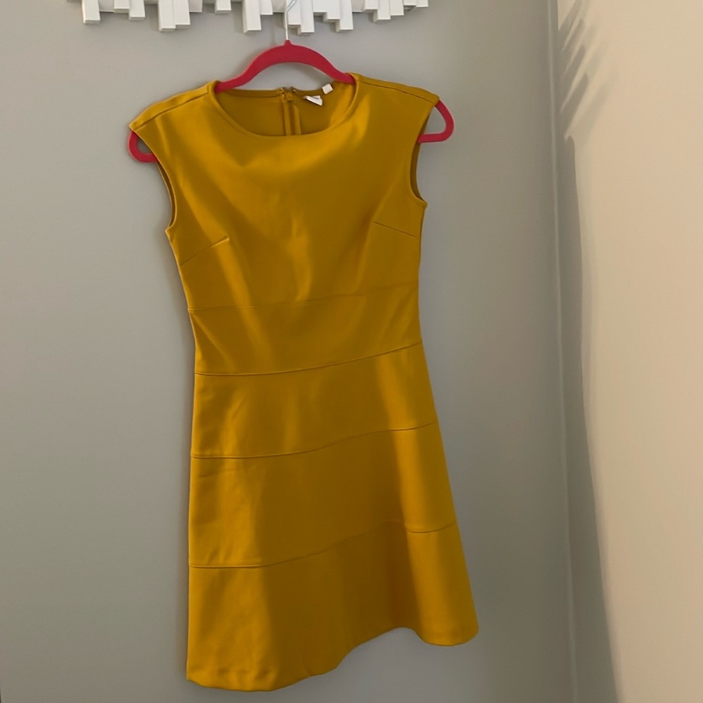 A mustard GAP dress in size 0 never worn, no tags.